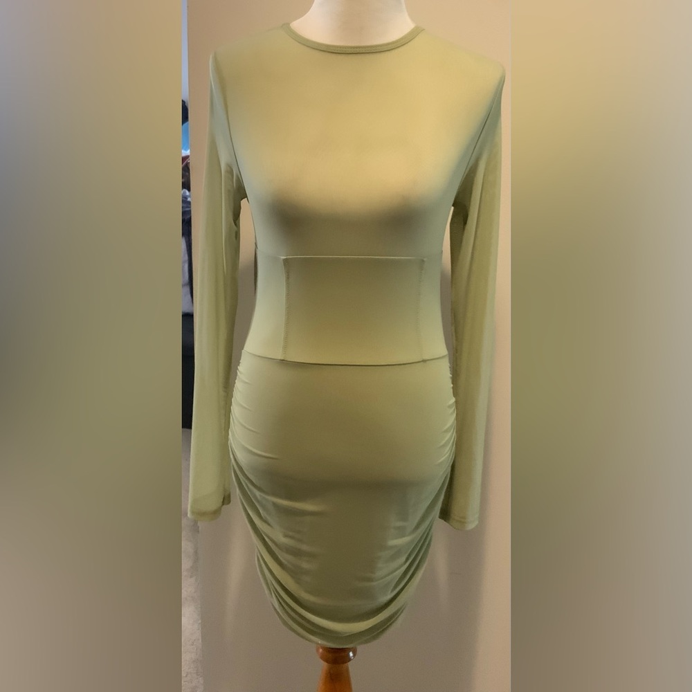 SAMPLE Pale Lime Green body hugging dress.  Ruching  down sides.  Size M.